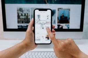 Person using Canva's mobile and web app