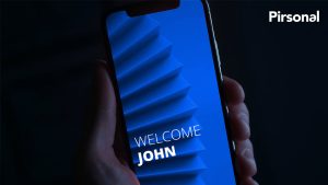 A hand holding a smartphone playing a personalized video made with Pirsonal