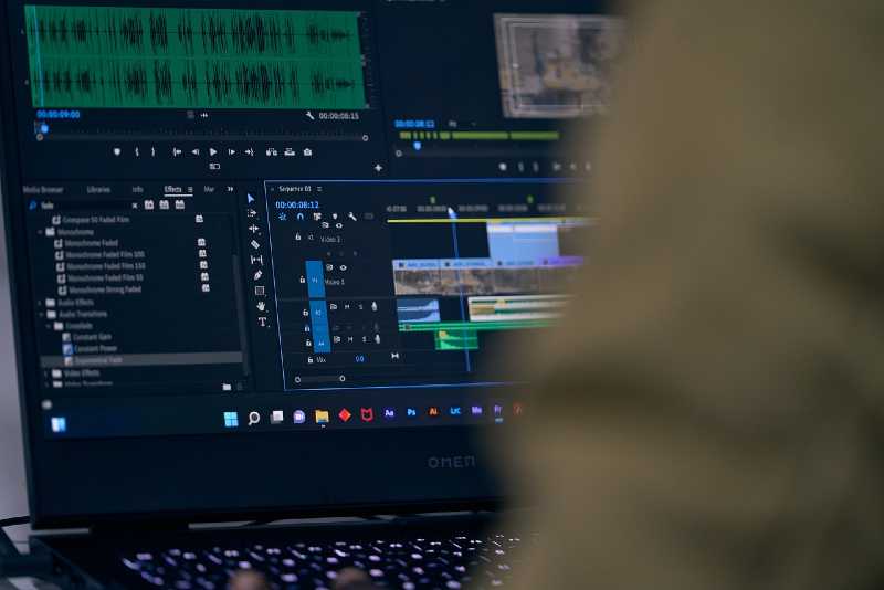 Man working on Premier to edit videos